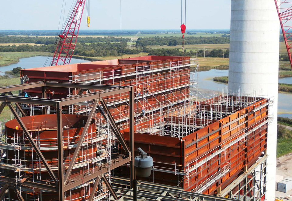 A crane and scaffolding on a construction job site.