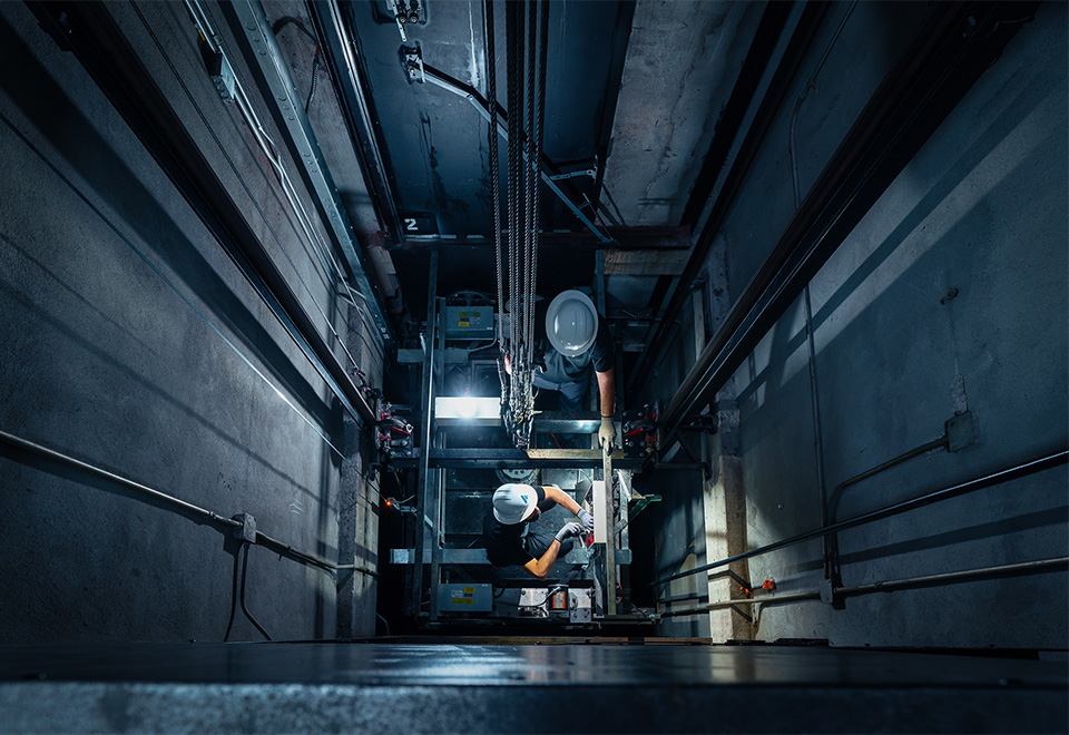 A worker holding a hard hat.