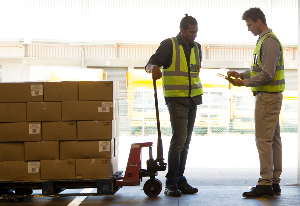 Workers looking at a shipment.