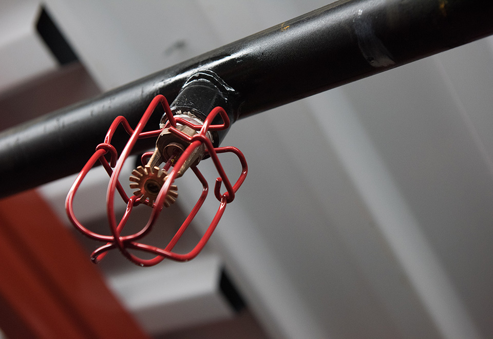 A red sprinkler head at Security Fire Protection Company, Inc.